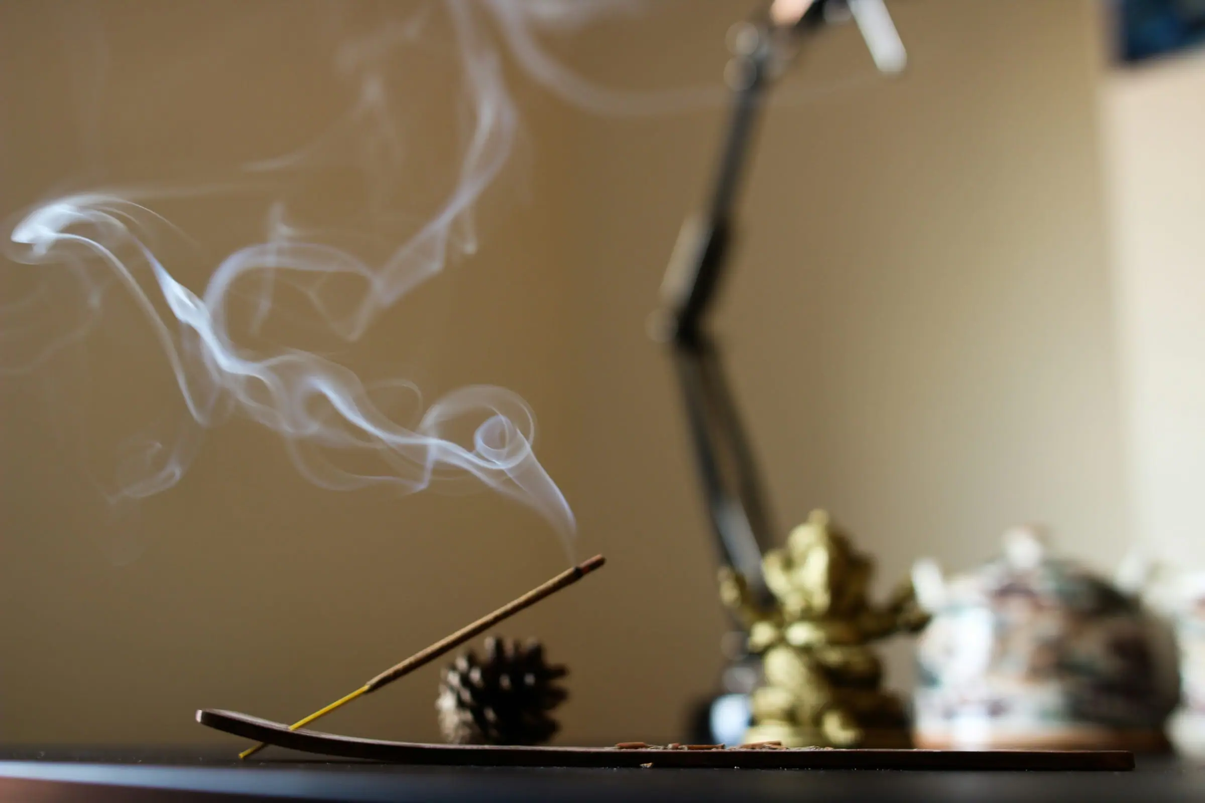 A soft trail of aromatic smoke in a quiet room