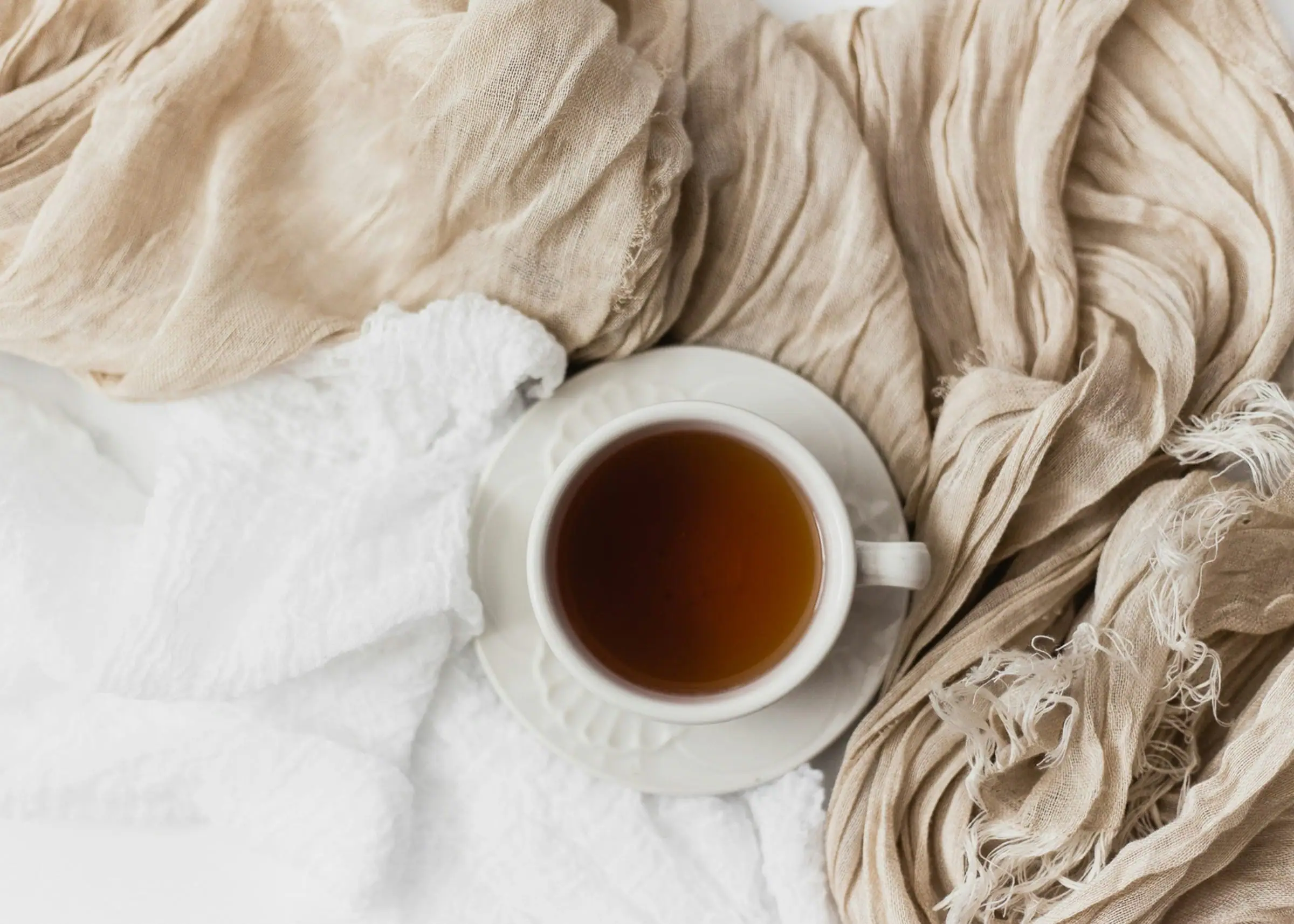 A warm drink and soft blanket prepared as a caring gesture